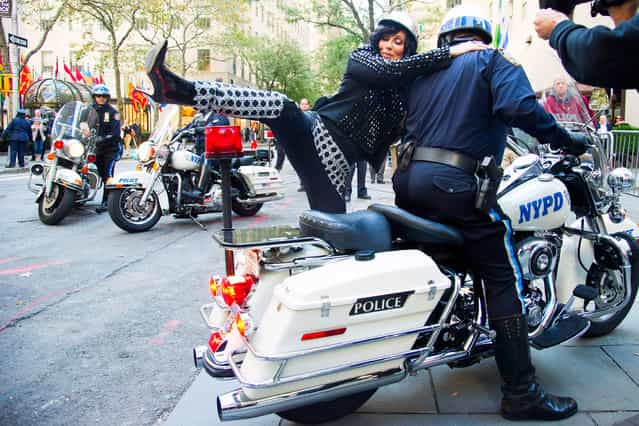 Cher arrives by police motorcycle for her performance on NBC's [Today] show on Monday, September 23, 2013 in New York. (Photo by Charles Sykes/AP Photo/Invision)