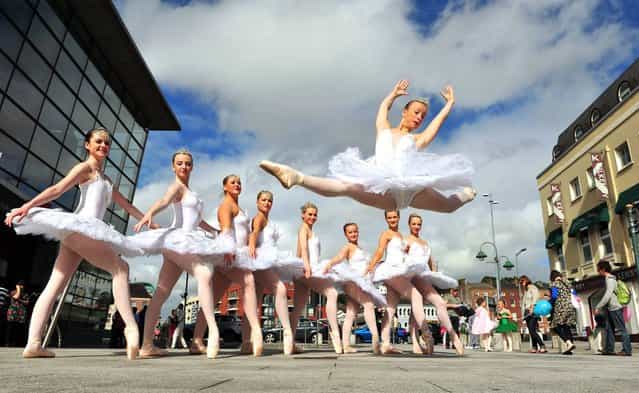 Sophie O'Leary, Cork School of Dance flying through the air at Emmet Place, Cork during the Cork City Ballet 21st year celebration's, on September 21, 2013. (Photo by Dan Linehan)