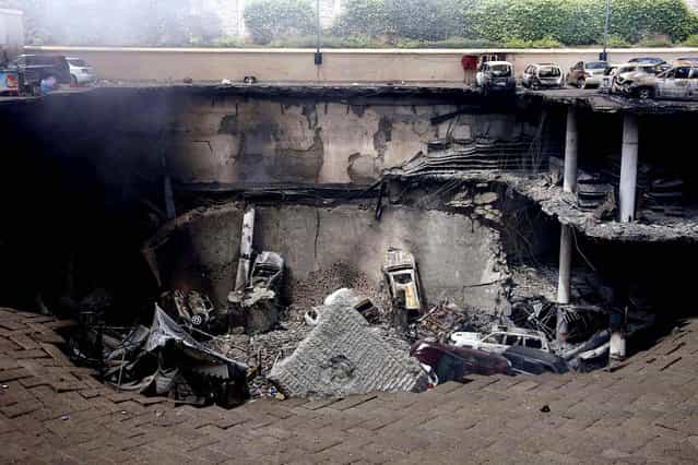 Destruction is seen at the Westgate Mall in Nairobi, on September 26, 2013, following a string of explosions during a stand-off between Kenyan security forces and gunmen inside the building. In Nairobi, experts from the U.S., British, Israei and other agencies have joined Kenyan officers investigating the mall where militants from the al Qaeda-aligned Somali group al Shabaab launched a well-planned assault on Saturday. (Photo by Presidential Strategic Communications Unit)