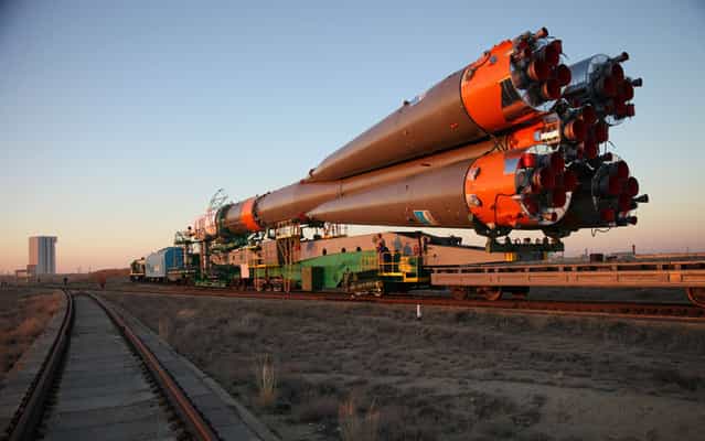 Russian Soyuz-FG rocket with Soyuz TMA-10M spacecraft aboard is transported to a launch pad at the Russian-leased Baikonur cosmodrome in Kazakhstan, on September 23, 2013. Soyuz TMA-10M is a planned transport the Expedition 37 crew, including Michael Hopkins of the US together with Russia's Oleg Kotov and Sergei Ryazansky, to the International Space Station (ISS) on September 26. (Photo by AFP Photo/STR)