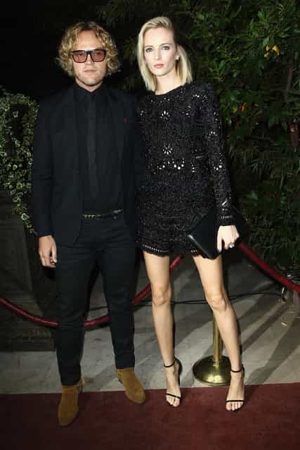 Peter Dundas and guest attend the [Mademoiselle C] cocktail party at Pavillon Ledoyen on October 1, 2013 in Paris, France. (Photo by Julien M. Hekimian/Getty Images)