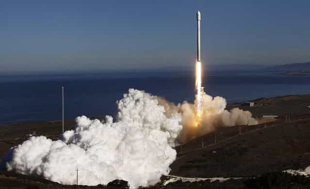 A Falcon 9 rocket carrying a small science satellite for Canada is seen as it is launched from a newly refurbished launch pad in Vandenberg Air Force Station, on September 29, 2013. The unmanned rocket blasted off from California on Sunday to test upgrades needed for planned commercial launch services. (Photo by Gene Blevins/Reuters)