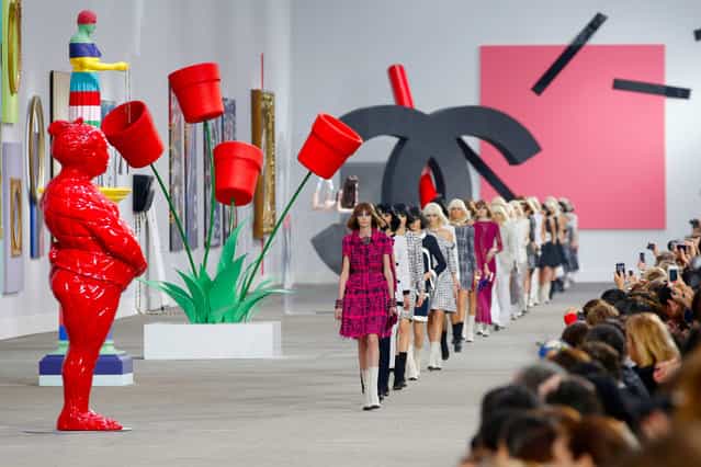 Models present creations as part of Chanel's ready-to-wear Spring/Summer 2014 fashion collection, presented Tuesday, October 1, 2013 in Paris. (Photo by Christophe Ena/AP Photo)