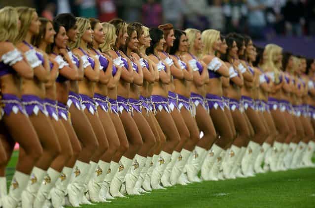 Minnesota Vikings' cheerleaders line up for the National Anthems prior to the NFL International Series match at Wembley Stadium, London, on September 29, 2013. (Photo by Andrew Matthews/PA Wire)