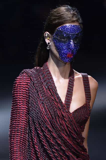 A model presents a creation for Givenchy during the 2014 Spring/Summer ready-to-wear collection fashion show in Paris, on October 1, 2013. (Photo by Miguel Medina/AFP Photo)