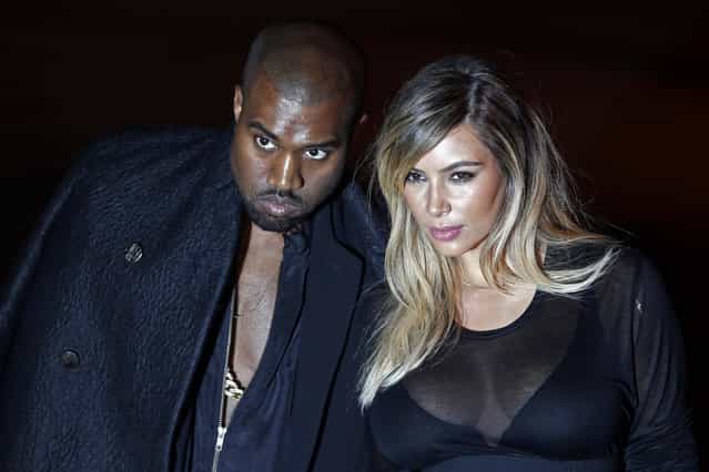 U.S. musician Kanye West (L) and companion Kim Kardashian arrive at the Givenchy Spring/Summer 2014 women's ready-to-wear fashion show during Paris Fashion Week September 29, 2013. (Photo by Charles Platiau/Reuters)