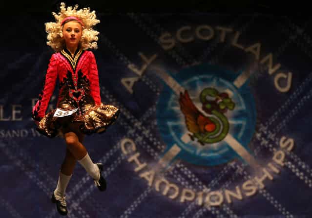 Shannon Love from the Scanlon dance school in Birmingham performs in one of the heats in the All Scotland Championships in Irish Dancing being held at the Royal Concert Hall in Glasgow. (Photo by Andrew Milligan/PA Wire)