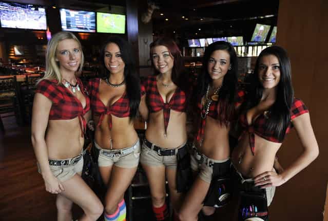 Servers at Twin Peaks restaurant in Wheeling, Il. on Thursday, October 3, 2013. Twin Peaks is one of the new wave of that have been growing rapidly the last few years, in part at the expense of Hooters, which is still the biggest in the category, but has been struggling somewhat. Twin Peaks and rival Tilted Kilt dress their waitresses in even skimpier outfits than Hooters – short shorts, bare midriffs and big emphasis on cleavage. A restaurant-industry veteran recently bought the rights to open franchised Twin Peaks locations in the Milwaukee area and is currently scouting local real estate. (Photo by Paul Beaty/Journal Sentinel)