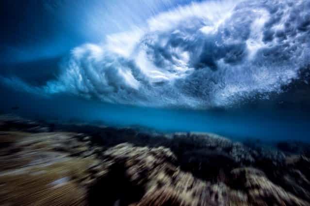 Stunning pictures of waves crashing from underneath. (Photo by Mark Tipple/Caters News Agency)