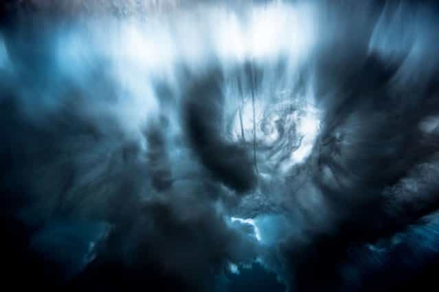 Stunning pictures of waves crashing from underneath. (Photo by Mark Tipple/Caters News Agency)
