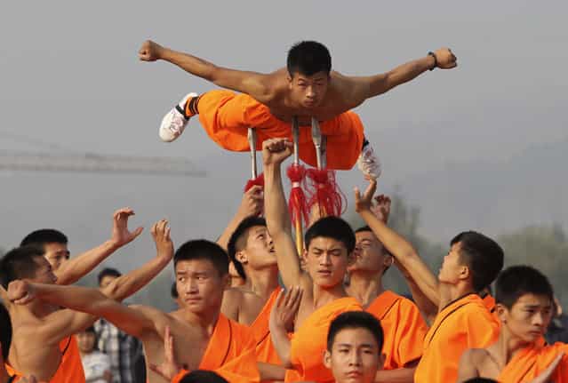 Shaolin martial arts students perform at Shaolin Temple in Dengfeng, Henan province, October 13, 2013. (Photo by Reuters/Stringer)