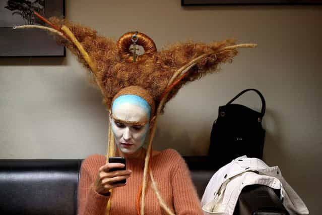 A model waits to be styled by the Dmitry Vinokurov team before performing at the ENIGMA Alternative Hair Show in the Royal Albert Hall in London, on Oktober 13, 2013. The show is one of the world's most prestigious hairdressing events, bringing together international teams of hair artists to showcase groundbreaking hair styling. (Photo by Oli Scarff/Getty Images)