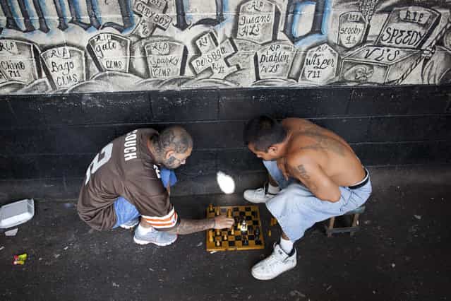 Inmates play chess at the Centro Preventivo y de Cumplimiento de Penas Ciudad Barrios. The prison is reserved for members of the Mara Salvatrucha (MS) gang. The prison has no guards and is run by the members of the gang. Since opening in 1999, the prison has filled up with gang members and now holds twice as many inmates as it was initially intended for. Conditions are extremely overcrowded and unsanitary and violence is common. (Photo by Adam Hinton)