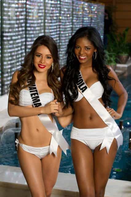 A handout picture provided by the Miss Universe Organization on 23 October 2013 shows Samayoa, Miss Guatemala 2013 and Vaumara Rebelo, Miss Angola 2013 posing for the presentation of swimwear collection Yamamay for Miss Universe at the Crowne Plaza Moscow World Trade Centre in Moscow, Russia, 23 October 2013. The 2013 Miss Universe Pageant will take place at the Crocus City Hall in Moscow on 09 November. (Photo by Darren Decker/EPA/Miss Universe Organization)
