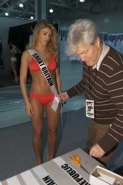 In a photo provided by the Miss Universe Organization Amy Willerton, Miss Great Britain 2013, is fitted by Costume Designer David Profeta, right, during registration and fittings on Wednesday, October 23, 2013 in Moscow. Willerton will compete for the Miss Universe title in Moscow, Saturday, November 9, 2013. (Photo by Patrick Prather/AP Photo)