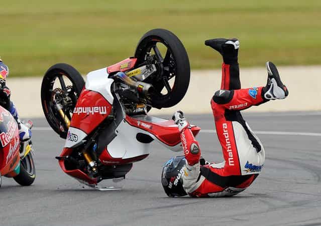 Miguel Oliveira of Portugal crashes on turn four during the Moto3 race at the Australian Motorcycle Grand Prix in Phillip Island, Australia, Sunday, October 20, 2013. (Photo by Andrew Brownbill/AP Photo)
