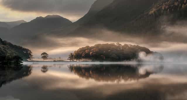 Undated handout photo issued by the Take a View - Landscape Photographer of the Year Awards of Mist and Reflections, Crummock Water, Cumbria, by Tony Bennett BSc LRPS winner of the Overall Winner in the Take a View – Landscape Photographer of the Year Awards. (Photo by Tony Bennett BSc LRPS/PA Wire/Take a View Landscape Photographer Of The Year Awards)