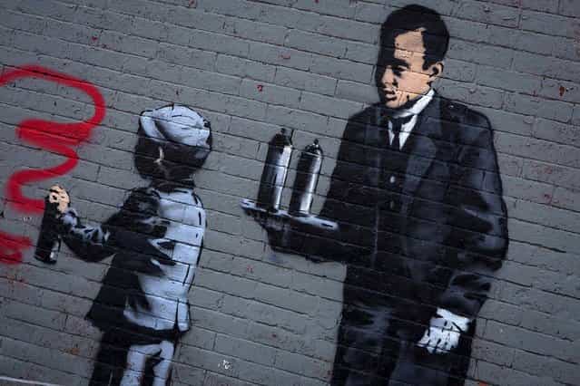 An installation by Banksy is seen in the Bronx. Known for his anti-authoritarian black-and-white stenciled images, which have sold at auction for upwards of $2 million, Banksy is treating New Yorkers to a daily dose of spray-painted art – while eluding the police and incurring the wrath of New York Mayor Michael Bloomberg. (Photo by Eric Thayer/Reuters)