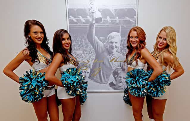 The Jacksonville Jaguars cheerleaders on their tour of Wembley Stadium next to the iconic Sir Bobby Moore photograph. Afterwards they swapped their pom poms for pencils to be tested on their knowledge of the stadium ahead of the game against the San Francisco 49ers this Sunday. The girls, from left to right, Caitlin, Kayla, Talitha and Jessica. (Photo by Scott Heavey/The FA)