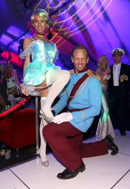 Actor Ian Ziering (R) and Erin Kristine Ludwig attend Playboy Mansion's annual Halloween bash on October 26, 2013 in Holmby Hills, California. (Photo by Christopher Polk/Getty Images for Playboy)