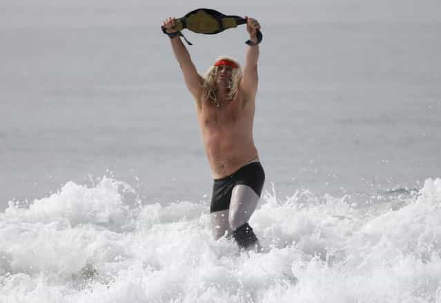 A man dressed as a wrestler competes in the ZJ Boarding House Halloween Surf Contest in Santa Monica, California October 26, 2013. (Photo by Lucy Nicholson/Reuters)