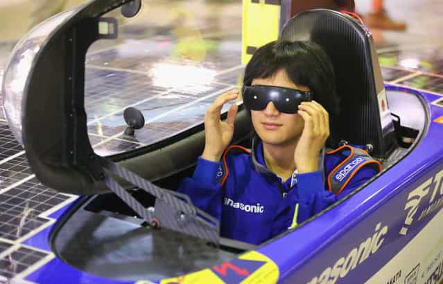 Kohhei Sagawa, a driver of the Tokai Challenger from Tokai University in Japan wears glasses as the solar car is height tested as cars are presented to the scrutineers for inspection and confirmation of their regulatory compliance and structural integrity on October 2, 2013 in Darwin, Australia. (Photo by Scott Barbour/Getty Images for the World Solar Challenge)