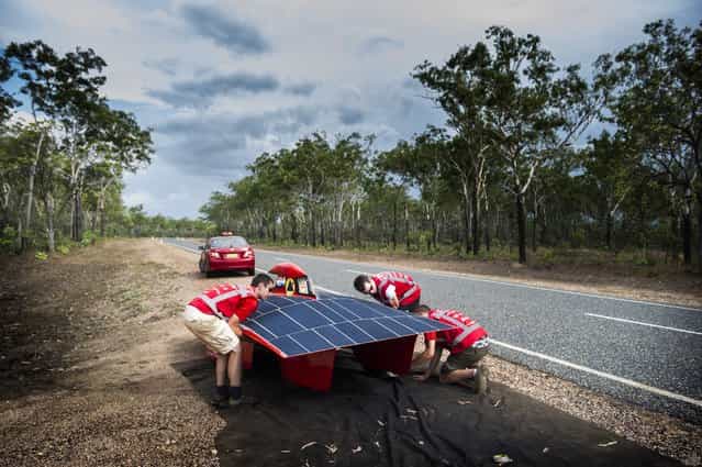 A handout image of the Red Engine Team obtained on 04 October 2013 shows the Red Engine going for a test drive around Darwin, Australia, 21 September 2013. The Dutch vehicle is competing in the World Solar Challenge, driving from Darwin to Adelaide starting on 06 October 2013. (Photo by Joost Van Baars/EPA/Red Engine Team)