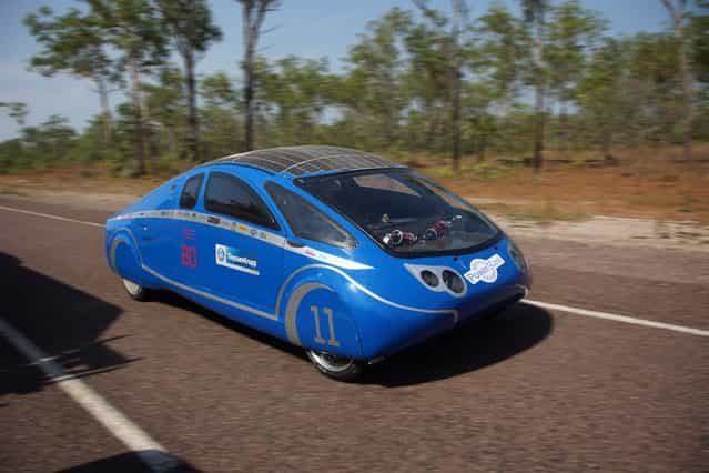A undated handout image provided by the Bochum University of Applied Sciences (Hochschule Bochum) on 04 October 2013 shows the German team Bochum's Cruiser class solar car during a test drive in the Northern Territoty, Australia, 16 September 2013. The Dutch vehicle is competing in the World Solar Challenge, driving from Darwin to Adelaide starting on 06 October 2013. (Photo by Hochschule Bochum/EPA)