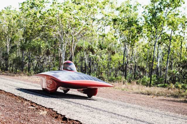 A handout image of the Red Engine Team obtained on 04 October 2013 shows the Red Engine going for a test drive on Cox Penninsula Road outside Darwin, Australia, 21 September 2013. The Dutch vehicle is competing in the World Solar Challenge, driving from Darwin to Adelaide starting on 06 October 2013. (Photo by Joost Van Baars/EPA/Red Engine Team)
