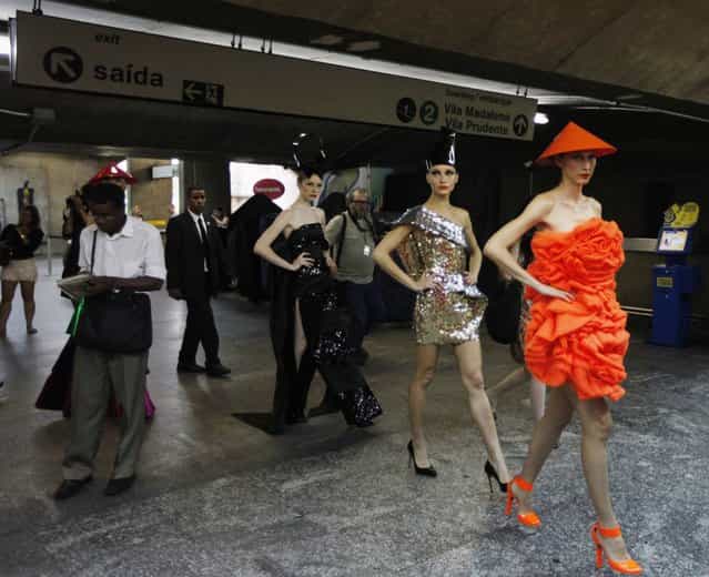 Models present creations in a subway station during Sao Paulo Fashion Week in Sao Paulo October 27, 2013. (Photo by Paulo Whitaker/Reuters)