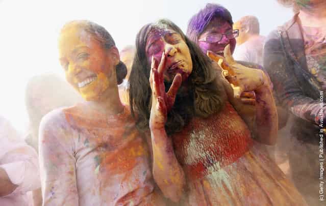 Revelers celebrate the Indian festival of Holi on a boat cruise around part of Manhattan