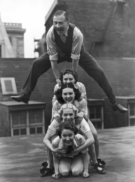 Jack Payne, the British dancer, pictured rehearsing with his troupe, 'Manhattan Six' on the roof of the Holborn Empire, 1938. (Photo by Fred Ramage)