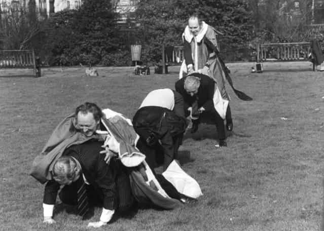 Five members of the House of Lords playing leap frog in London's Park Lane to raise money for St. John's Ambulance; (from the front) Lord Ilchester, Lord Redesdale, Lord Marchwood, Lord Kimberley and Lord Attlee. 28th February 1980.