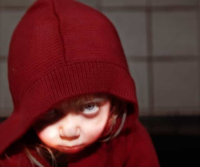 Little Red Riding Hood. [The moment I pulled this sweater out of the drawer for Frankie I knew what I wanted for my picture today. I envisioned the look, the style, and the composition. When working with a 2 year old it is never easy to actually get the shot you want, especially when they decide to skip nap time. But I really like how this one turned out] – Rich. (Photo by Rich)