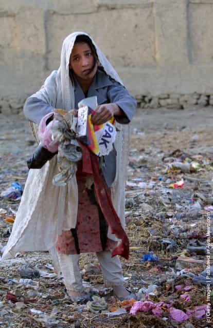 Roina,10, works on the street collecting garbage January 1, 2002 after leaving the Aschiana Child Center, a drop in center for street children in Kabul, Afghanistan