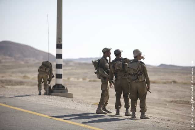 Soldiers set up a check point 60 km from Eilat, following series of coordinated gun and roadside bomb attacks against miltary and civilian targets near the Israeli - Egyptian border