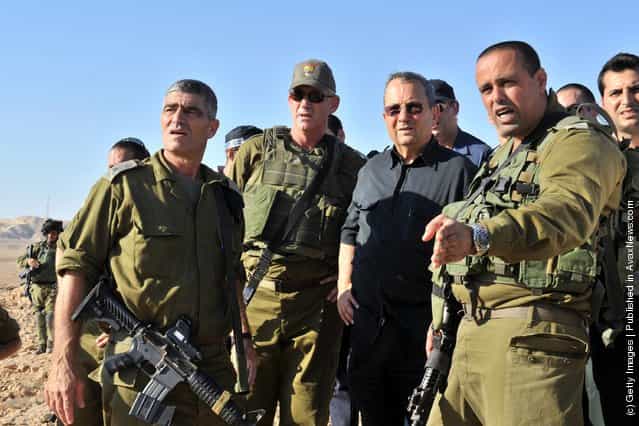 Israeli Defense Minister Ehud Barak visits the scene following series of coordinated gun and roadside bomb attacks against miltary and civilian targets near the Israeli - Egyptian border