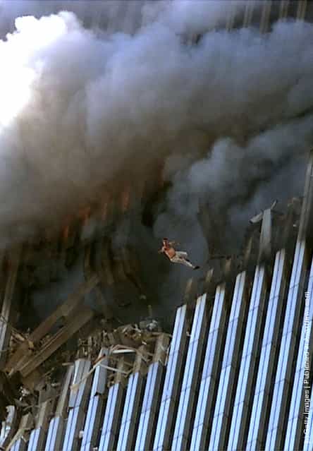 A man fall to his death from the World Trade Center after two planes hit the building September 11, 2001 in New York City