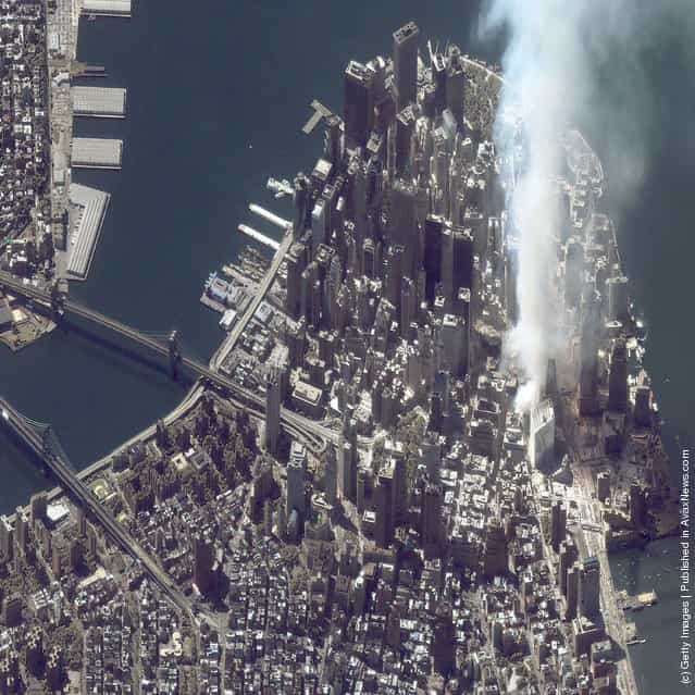 A satellite image of lower Manhattan shows smoke and ash rising from the site of the World Trade Center at 11:43 a.m. September 12, 2001 in New York City