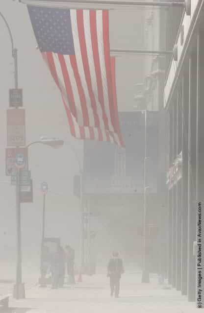 Dust swirls around south Manhattan moments after a tower of the World Trade Center collapsed September 11, 2001