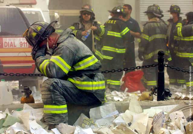 A firefighter breaks down after the World Trade Center buildings collapsed September 11, 2001