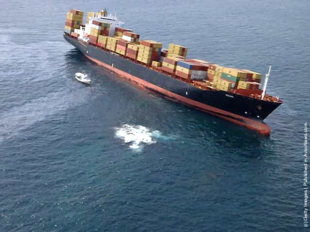 Fly-over shots of stranded cargo vessel Rena grounded on the Astrolabe Reef