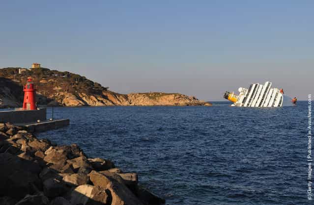 The cruise ship Costa Concordia lies stricken off the shore of the island of Giglio in Giglio Porto, Italy