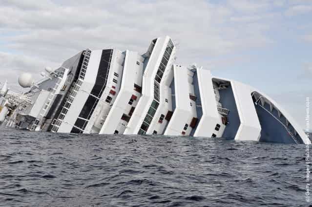 The cruise ship Costa Concordia lies stricken off the shore of the island of Giglio, on January 17, 2012 in Giglio Porto, Italy. More than four thousand people were on board when the ship hit rocks last Friday