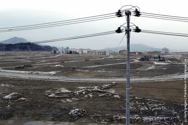 A seemingly vacant area of land stretches across the center of town on March 11, 2012 in Rikuzentakata, Japan