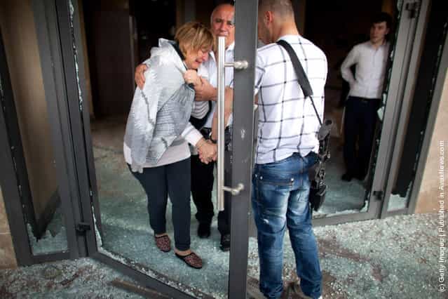 An Israeli woman is evacuated following a rocket attack from the nearby Gaza Strip