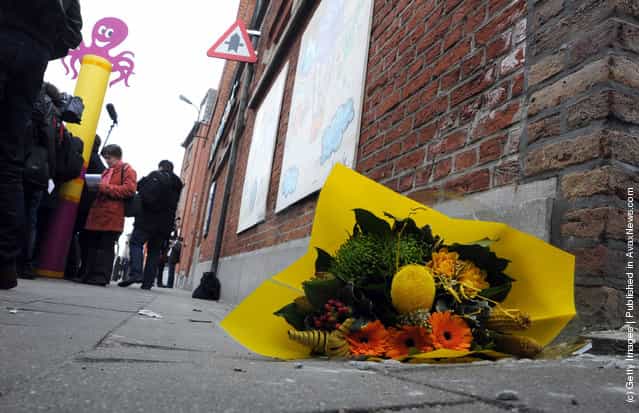 Floral tributes are left at the gates of Sint Lambertus School, following a bus crash that killed 22 children in Switzerland, on March 14, 2012 in Heverlee, Belgium