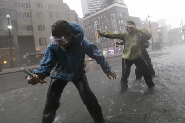 Research students from the the University of Alabama measure wind speeds as Hurricane Isaac whips through New Orleans on Wednesday, Aug. 29 – seven years to the day that Katrina struck. (Photo by Eric Gay/AP)