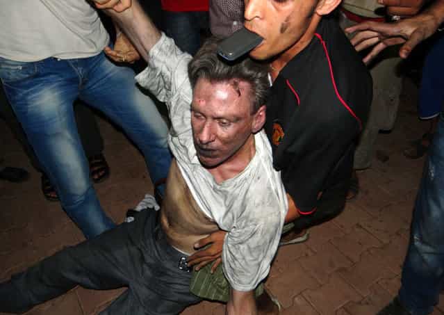 US ambassador to Libya, Chris Stevens, in the hands of Libyans.