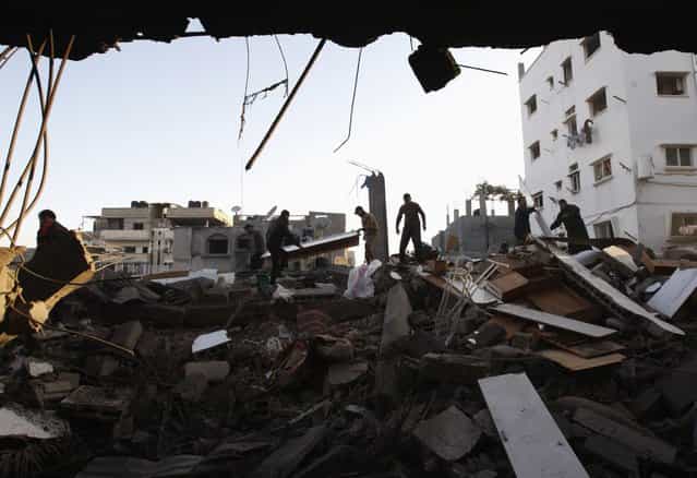 Palestinians inspect a destroyed house after an Israeli air strike in Gaza City November 18, 2012. Israel bombed militant targets in Gaza for a fifth straight day on Sunday, launching aerial and naval attacks as its military prepared for a possible ground invasion, though Egypt saw [some indications] of a truce ahead. (Photo by Ahmed Zakot/Reuters)